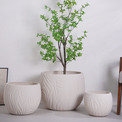 खरीदें neutral beige round fiber clay planter with irregular wavy lines pattern lightweight durable low-maintainence flower pot holiday Villa hotel shopping mall office decoration garden landscaping project online manufacture